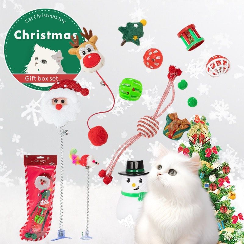 Cat Christmas toy gift set with various toys and a cat in front of a Christmas tree.
