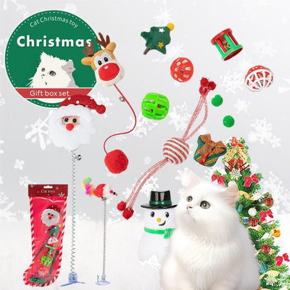 Cat Christmas toy gift set with various toys and a cat in front of a Christmas tree.